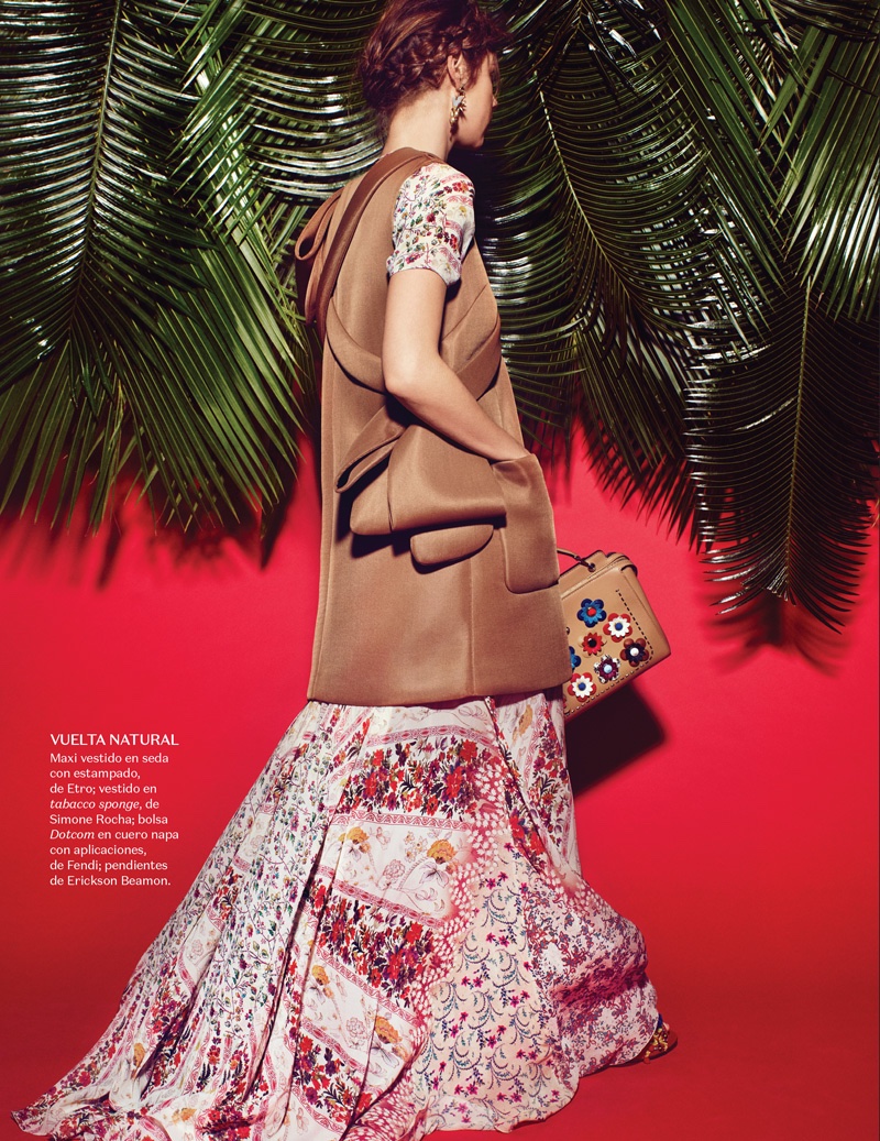 The model layers up in an Etro floral print maxi dress and Simone Rocha bag