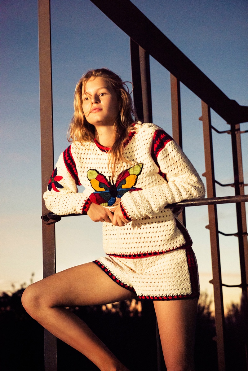 Soaking up the sun, Anna Ewers wears a butterfly sweater with matching shorts