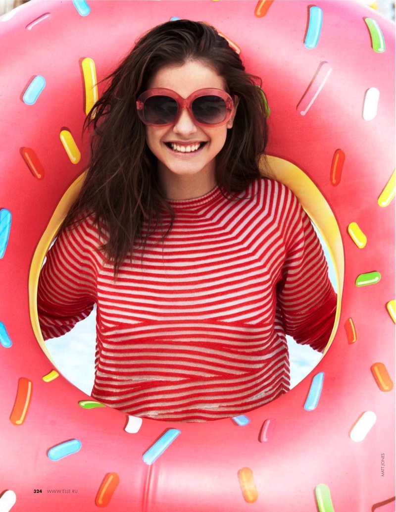 Wearing red framed sunglasses and a striped top from Giorgio Armani, Barbara is all smiles