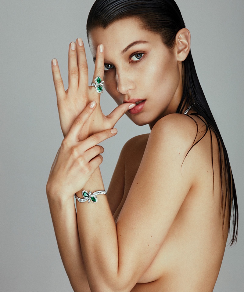 Glittering in jewelry, Bella Hadid poses topless in this shot