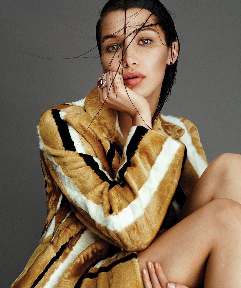 Bella Hadid models a Prada striped jacket with Bulgari ring