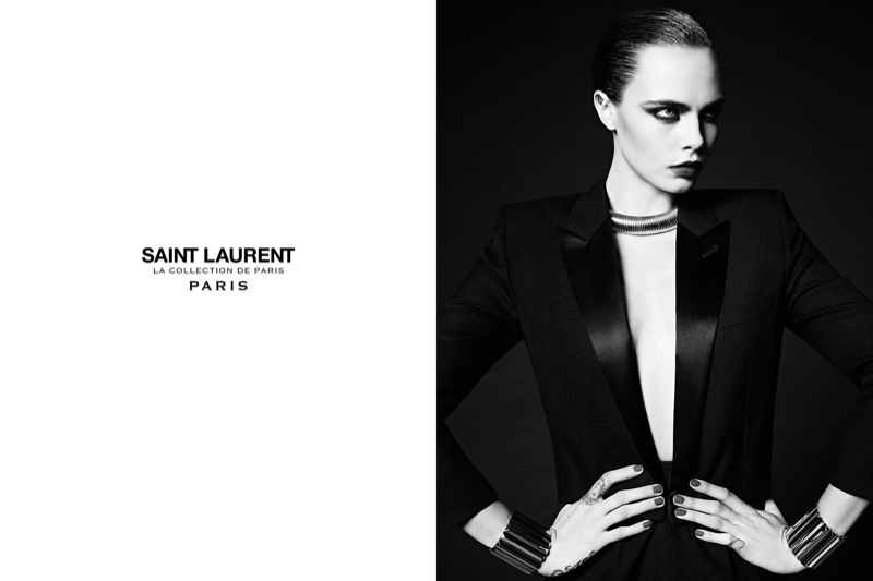 Posing with her hands on her waist, Cara Delevingne models a tuxedo jacket from Saint Laurent's Paris collection