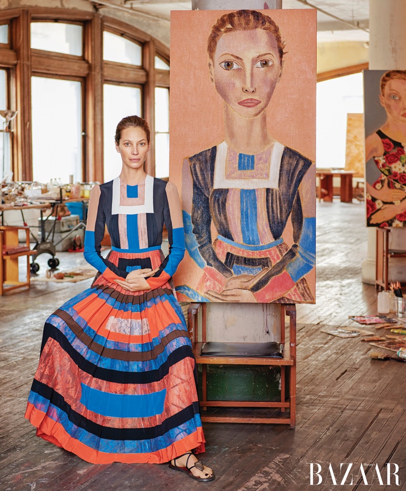 Christy Turlington poses next to Francesco Clemente portrait. Photo: Harper's Bazaar / Jason Schmidt 