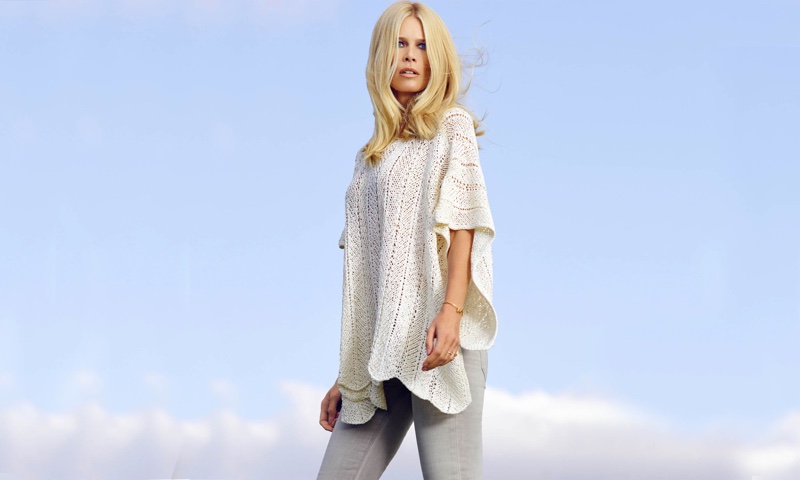 Claudia Schiffer models a white knit tunic from TSE collaboration