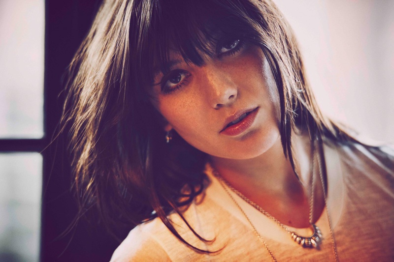 Daisy Lowe shows off her signature hairstyle with full bangs in Pamela Love campaign