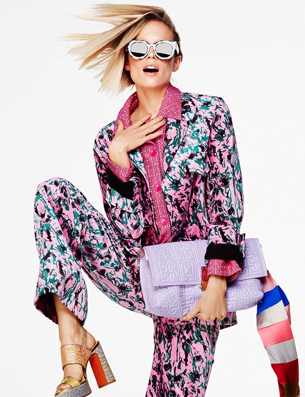 SHE WEARS THE PANTS: Tosca models a printed pant suit with a large clutch