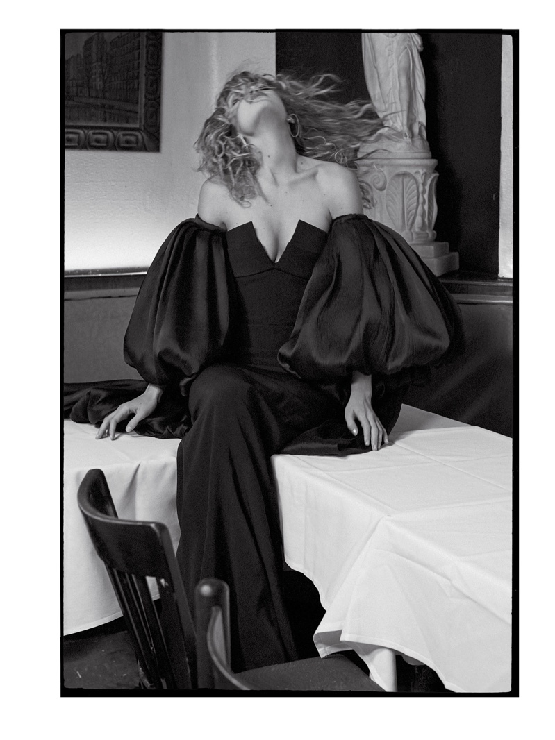 Captured in black and white, Gigi models a Brandon Maxwell dress with puffed sleeves