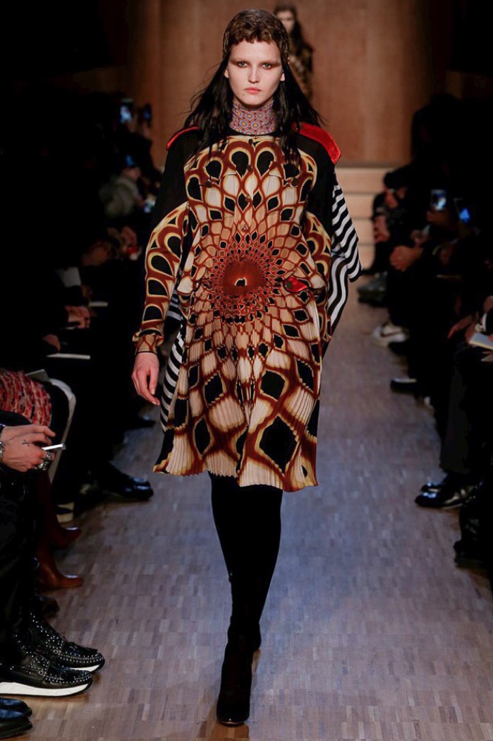 A model walks the runway at Givenchy's fall-winter 2016 show wearing a long-sleeve patterned dress