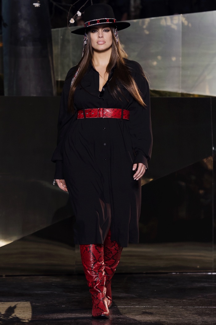 Ashley Graham walks the H&M Studio fall-winter 2016 show wearing a belted dress, gaucho hat and red python print boots