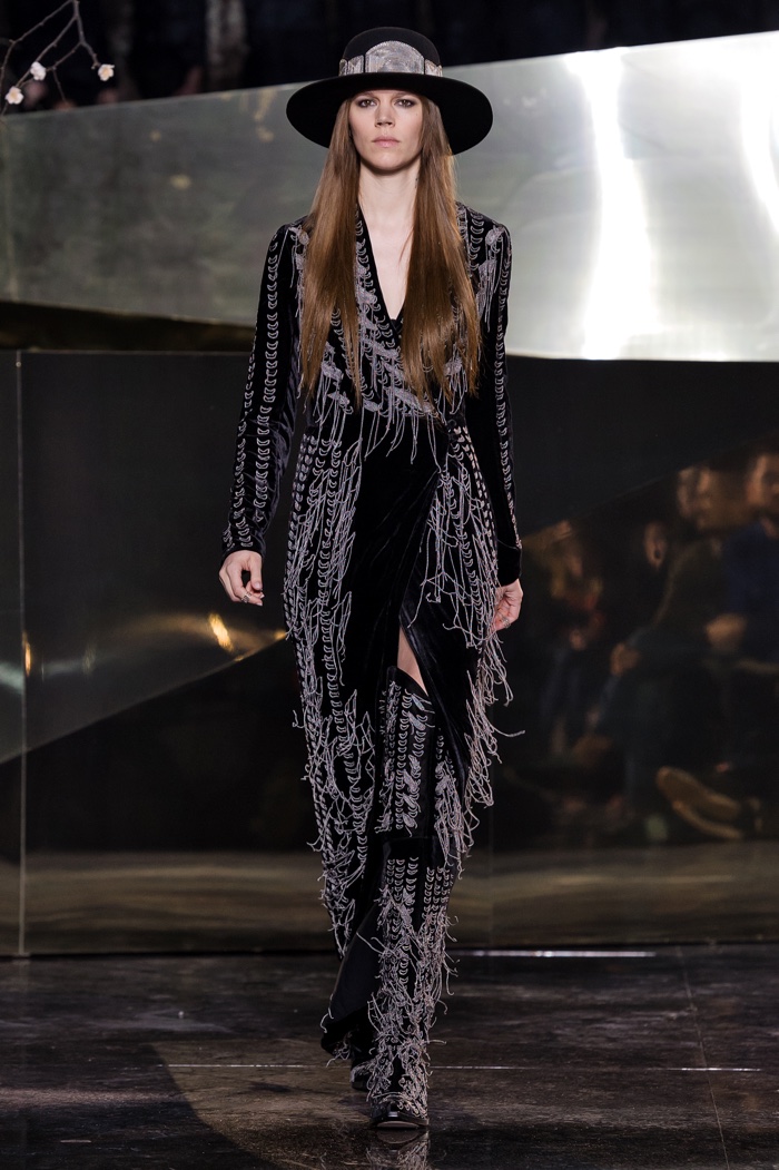 Freja Beha Erichsen walks the H&M Studio fall-winter 2016 show wearing a fringe embellished coat and matching boots