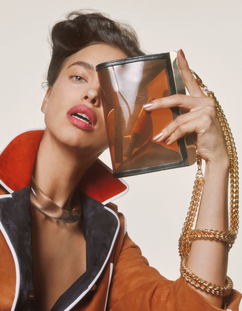 Irina Shayk models a Prada jacket and Balmain bag