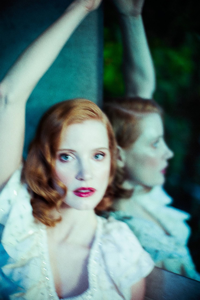 Jessica Chastain shows off a retro inspired beauty look with rouged cheeks and a red lip