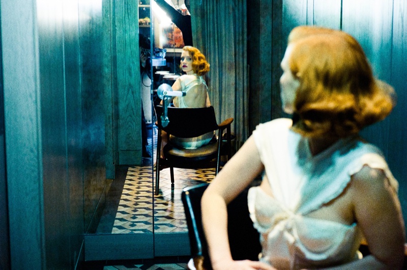 Jessica Chastain looks to the mirror while wearing a Balenciaga playsuit