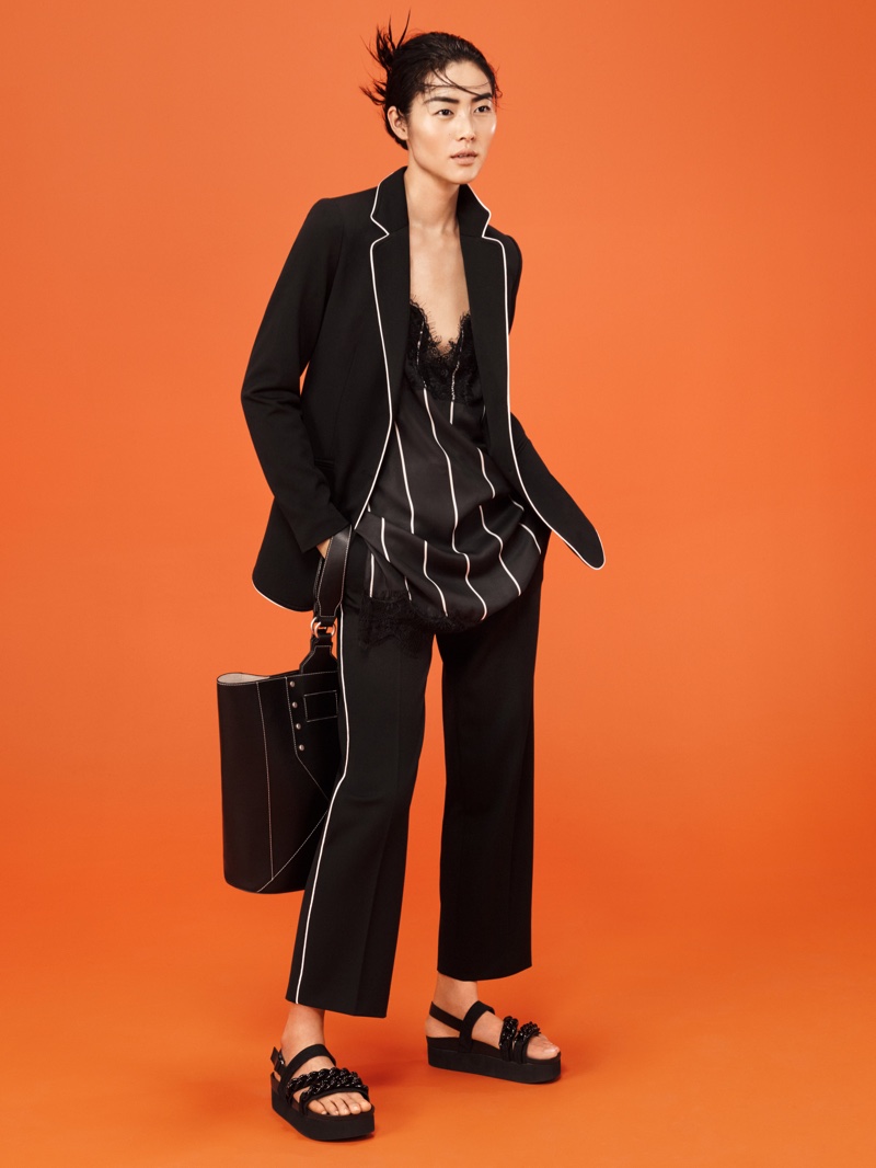 Liu Wen suits up in a minimal black look from Mango's March 2016 campaign