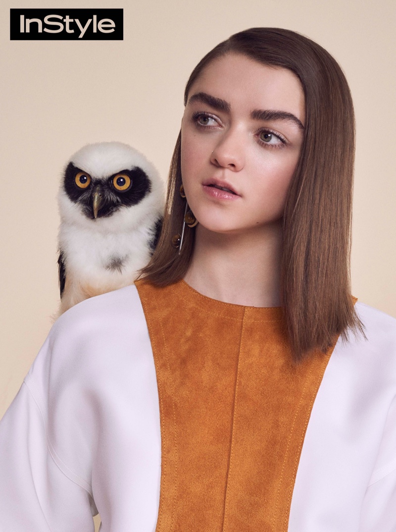 Photographed with an owl, the Game of Thrones actress wears a suede top