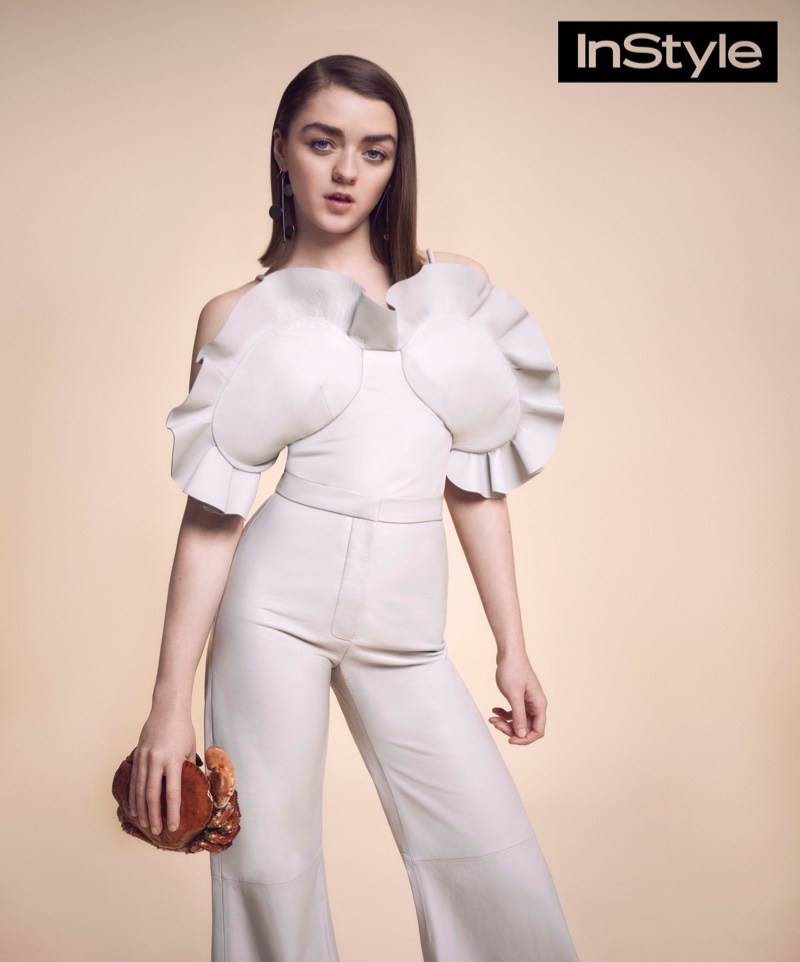Starring in the April issue of InStyle UK, Maisie poses in a white jumpsuit with a pleated top