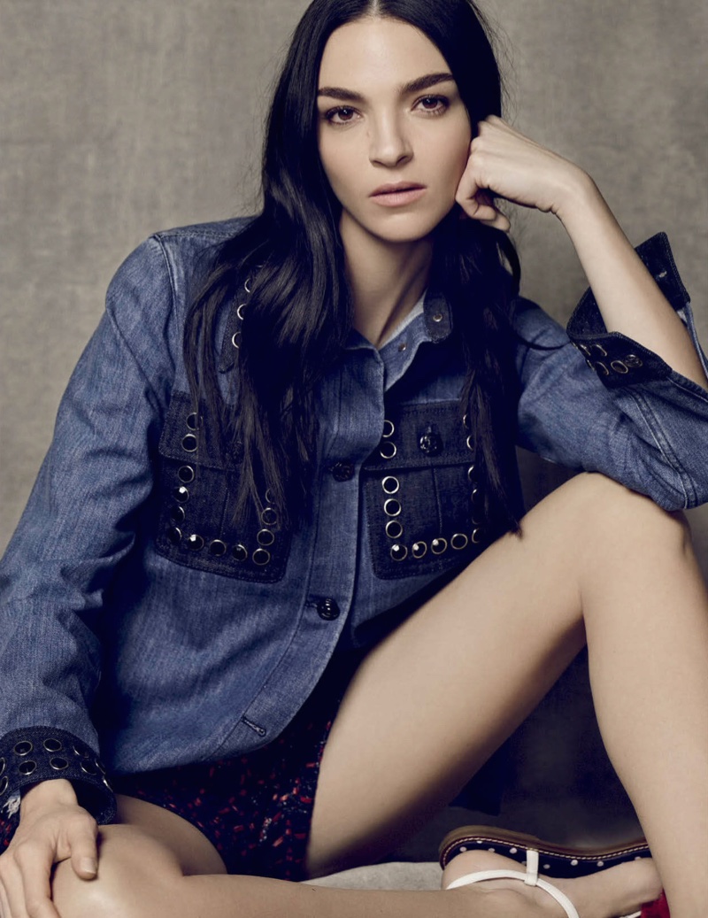 Mariacarla has a casual moment in a denim shirt with grommets