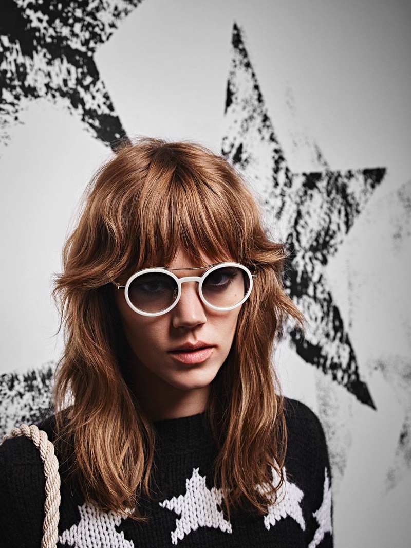 Wearing a hairstyle with bangs, Freja Beha models round sunglasses from Max Mara's spring 2016 collection