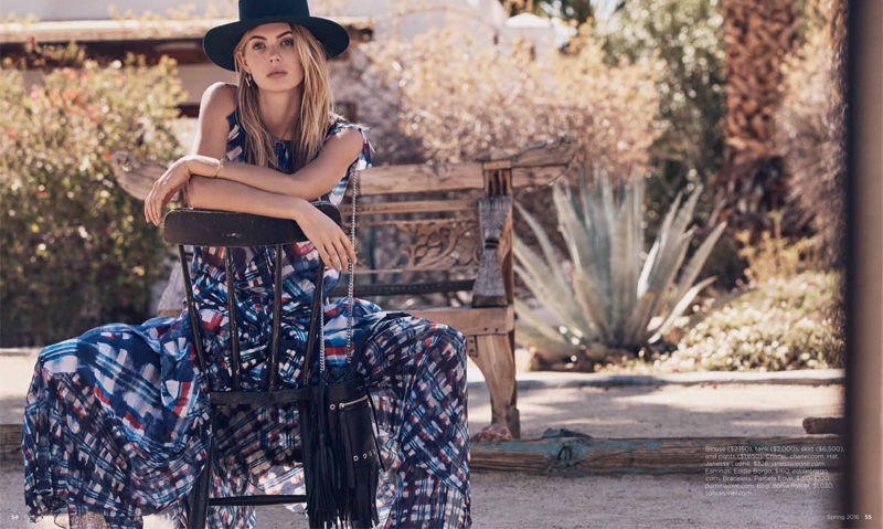 Modeling a wide-brimmed hat, Megan poses in a matching print top and skirt from Chanel's spring collection