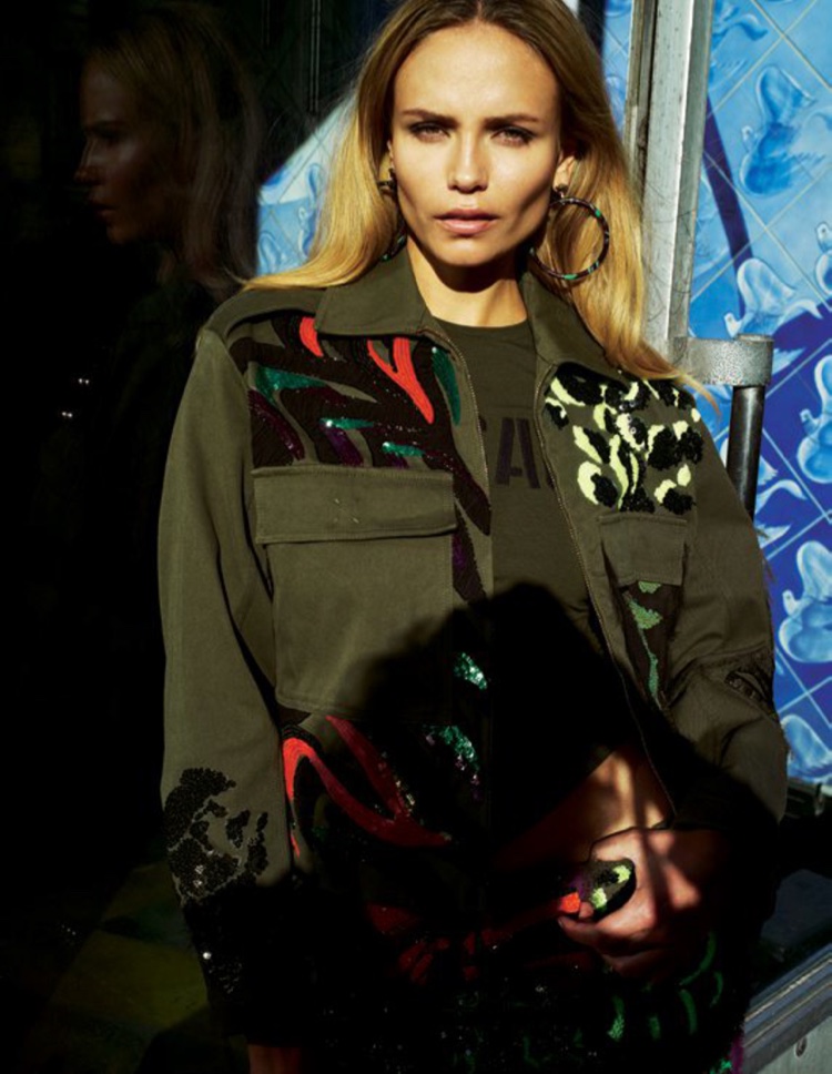 Natasha Poly models a military inspired jacket from Versace