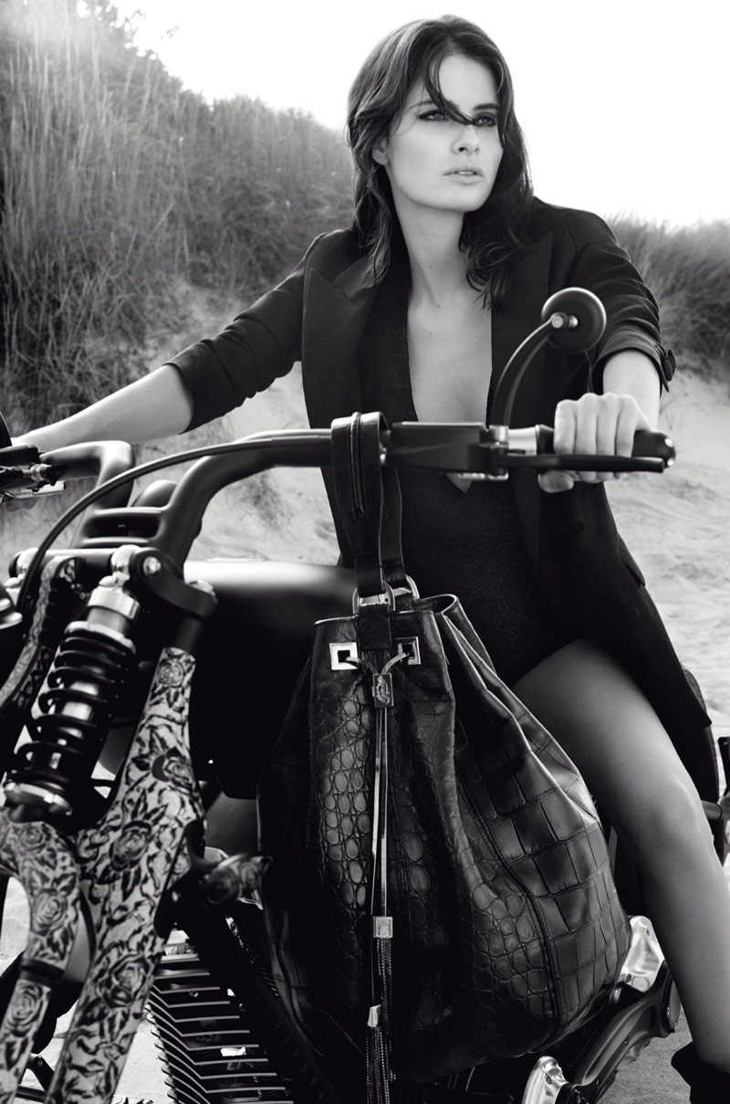 Posing on a motorcycle, Isabeli Fontana models a fitted blazer from Redemption Choppers