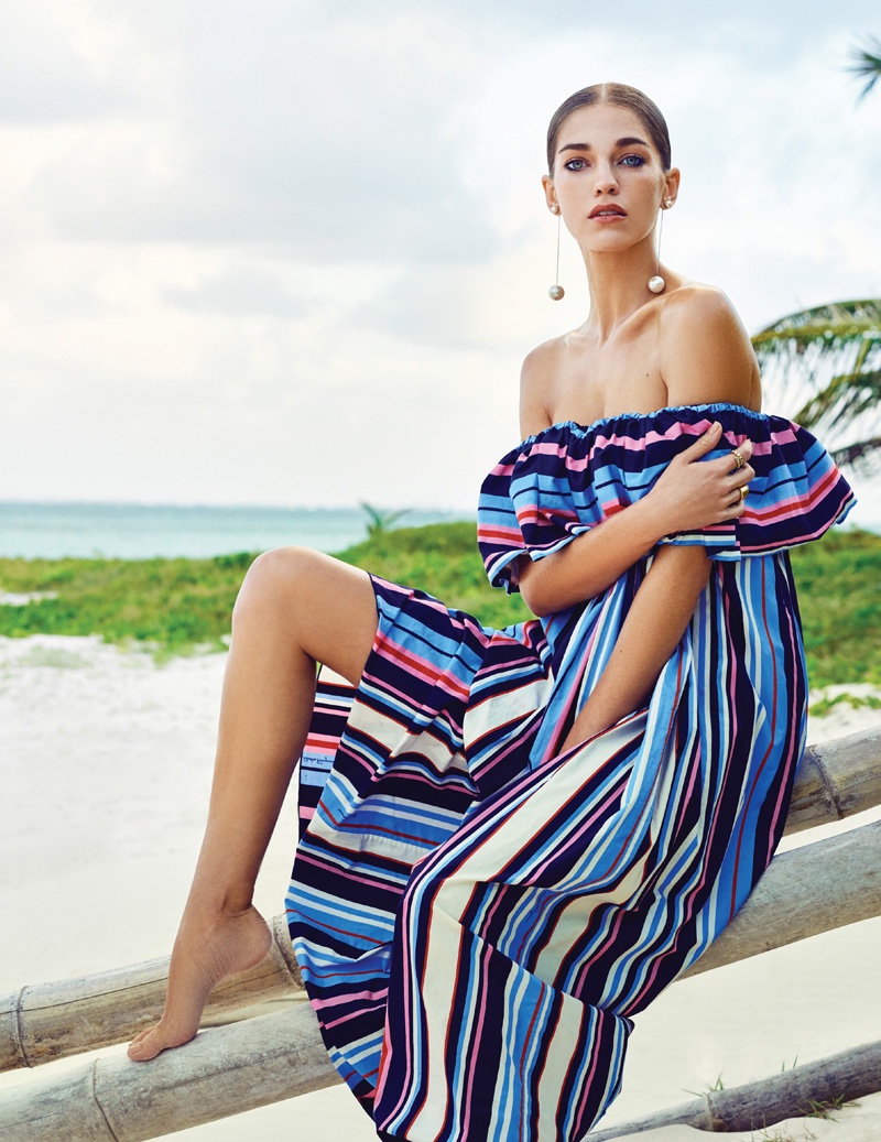 Samantha Gradoville models an off the shoulder Salvatore Ferragamo dress with multi-colored stripes