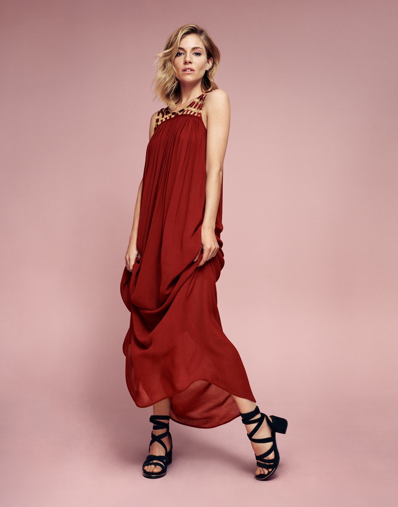 Sienna Miller poses in a red maxi dress from Lindex's spring 2016 collection