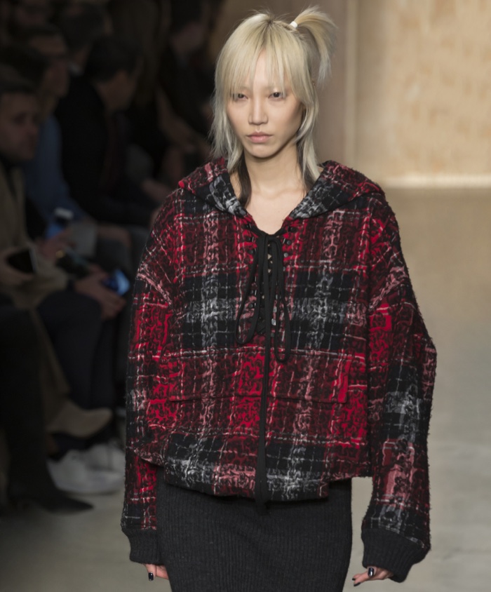 FEBRUARY 2016: Soo Joo Park walks the runway at DKNY's fall-winter 2016 show presented during New York Fashion Week wearing a plaid sweatshirt. Photo: Ovidiu Hrubaru / Shutterstock.com 