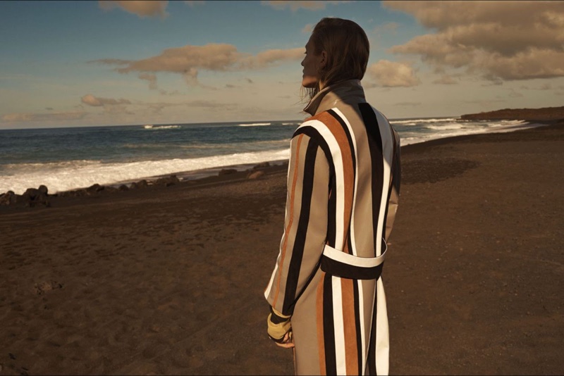 Toni Garrn shows off a striped coat from the back