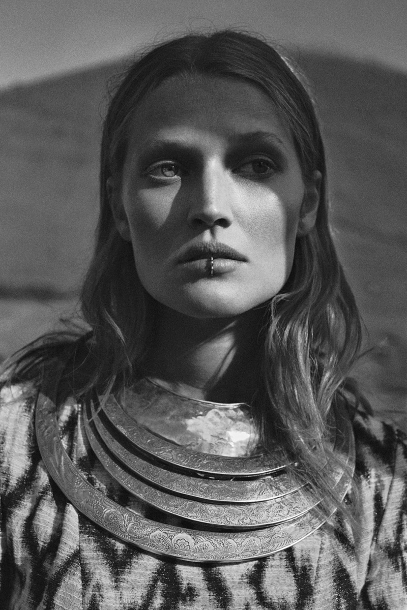 Toni models a layered bib necklace with lip jewelry