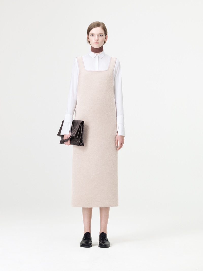 COS' fall 2016 collection features white dress shirt with overall dress and clutch bag