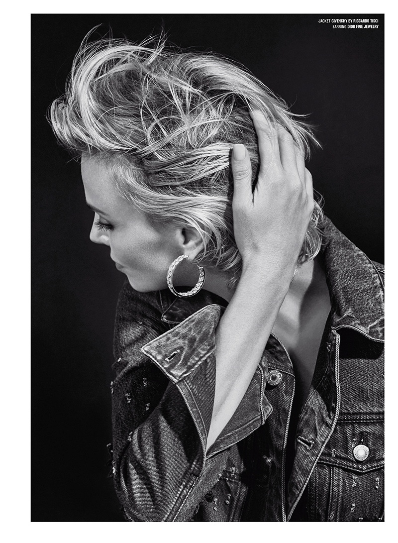 Photographed in black and white, Charlize wears a Givenchy by Riccardo Tisci denim jacket