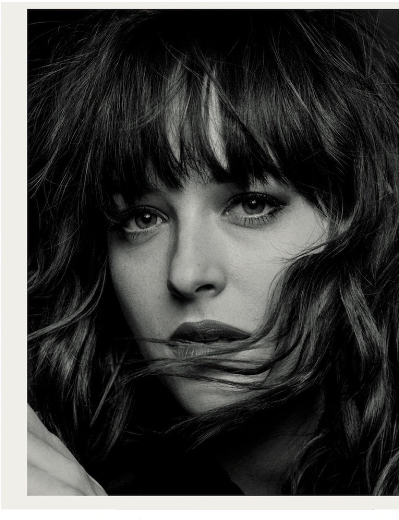 Dakota Johnson gets her closeup with a wavy hairstyle featuring full bangs