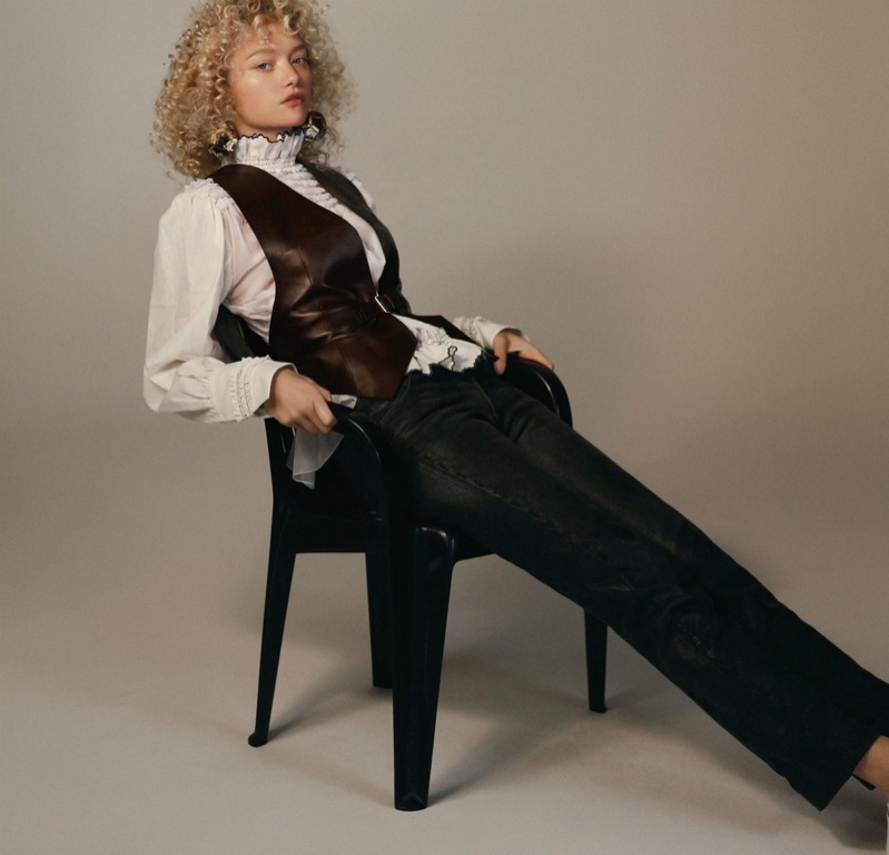 Gemma Ward wears a Louis Vuitton leather vest, puffy blouse and black trousers