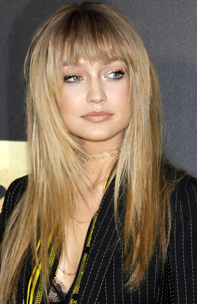 APRIL 2016: Gigi Hadid attends the 2016 MTV Movie Awards wearing a shaggy hairstyle with bangs