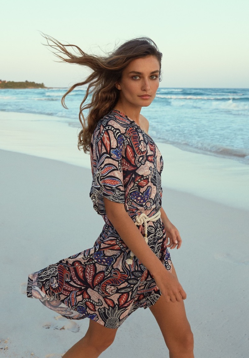 Posing on the beach, Andreea Diaconu wears a printed dress from H&M