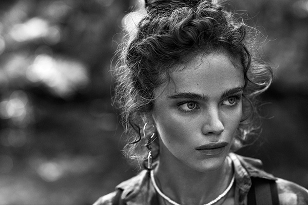 Wearing her hair in a wavy updo, Jena Goldsack stuns in this black and white shot