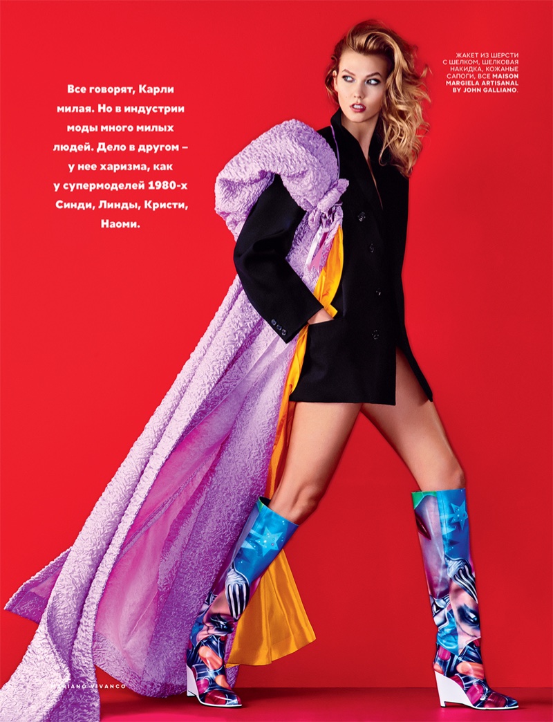 Karlie Kloss shows some leg in a jacket and multi-colored boots from Maison Margiela Artisanal