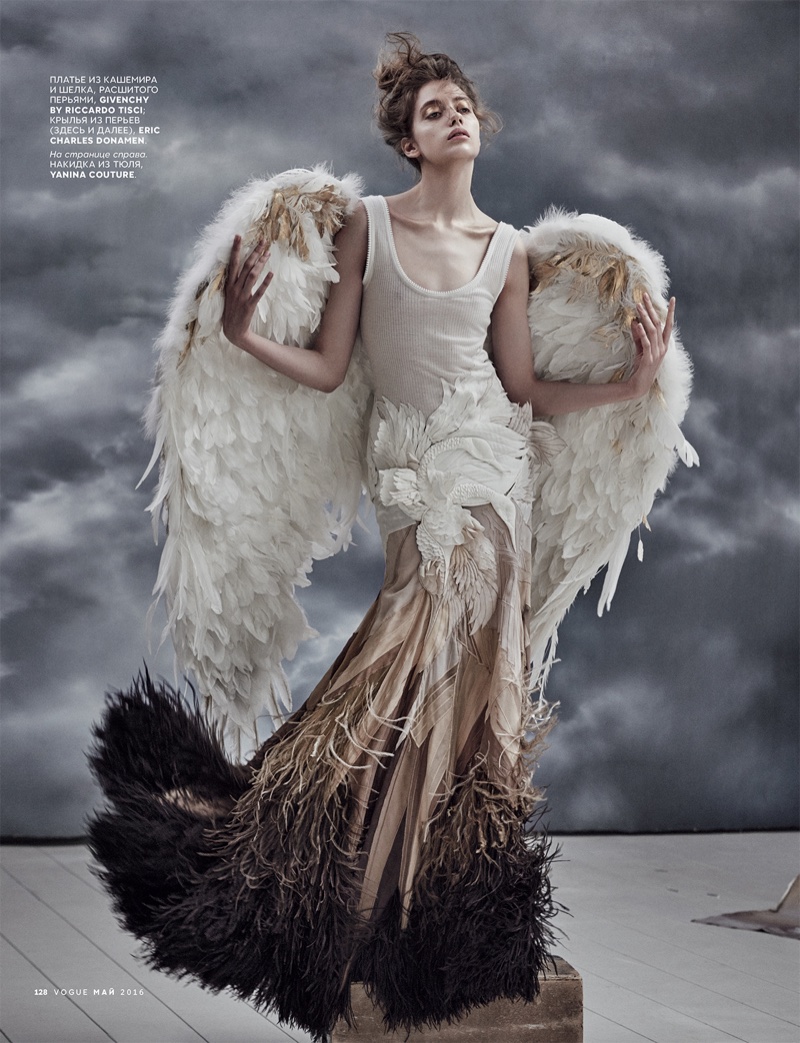 Model wears Givenchy by Riccardo Tisci skirt with gilded wings