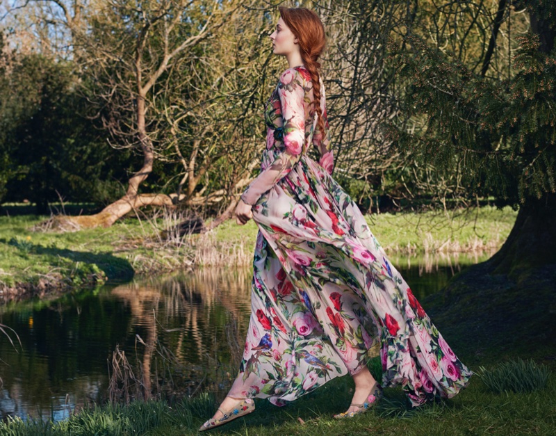 Looking like she is walking on air, Sophie Turner poses in Dolce & Gabbana floral print dress with Tabitha Simmons embellished flats