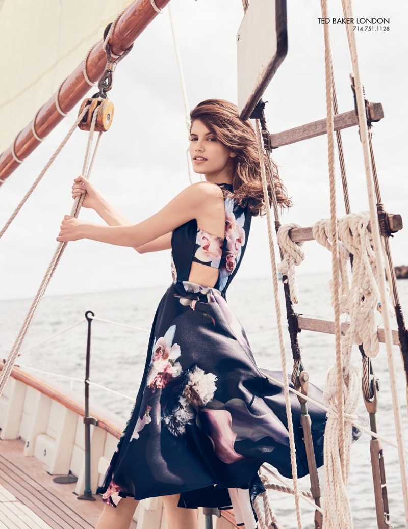 The model sets sea in a floral print Ted Baker London dress