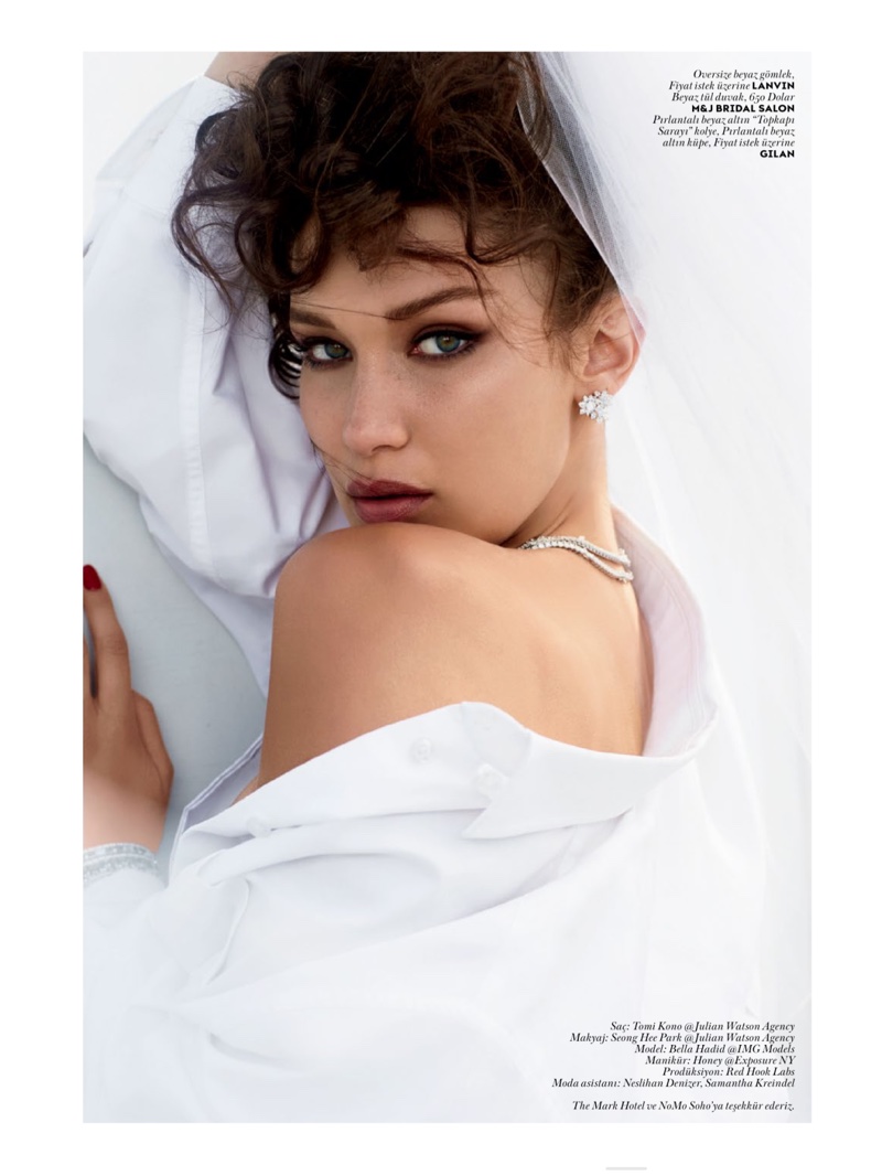 Photographed with a curly updo, Bella wears a smokey eyed beauty look