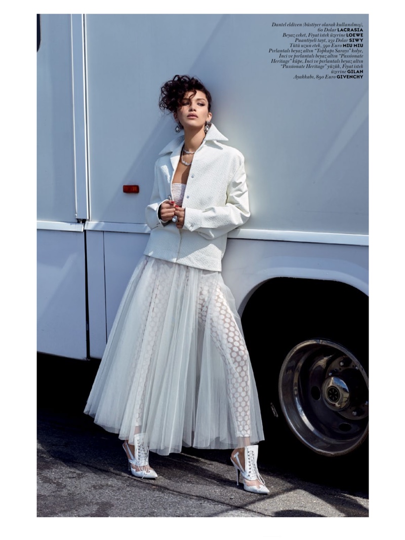 Posing in all white, Bella Hadid serves up retro vibes for the fashion shoot