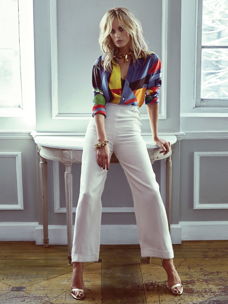 Standing tall, Carolyn Murphy wears multi-colored shirt with high-waisted trousers from Ralph Lauren
