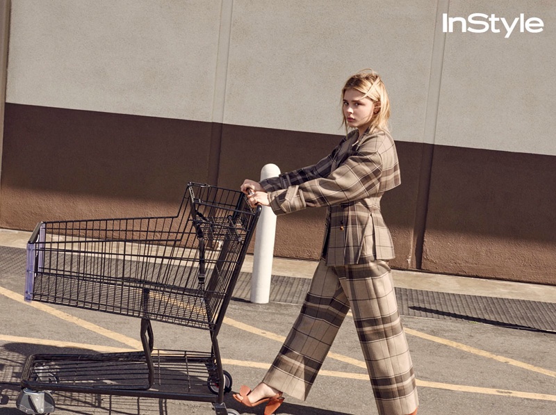 Pushing a shopping cart, Chloe Grace Moretz wears plaid Celine jacket and trousers