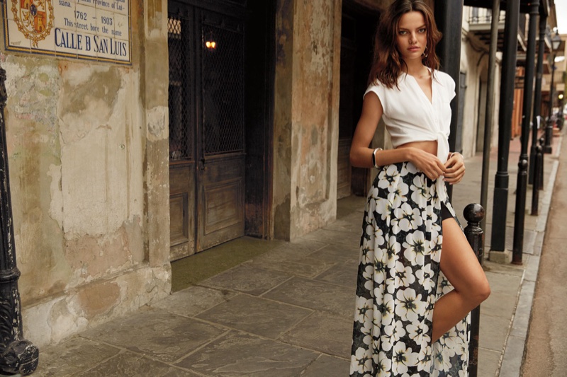 Barbara Fialho flaunts her leg in a white crop top and floral print skirt with high slit from Dynamite