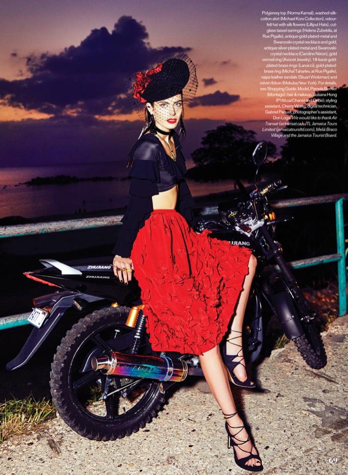 Sitting on a motorbike, Pamela wears Norma Kamali top and embellished Michael Kors Collection skirt