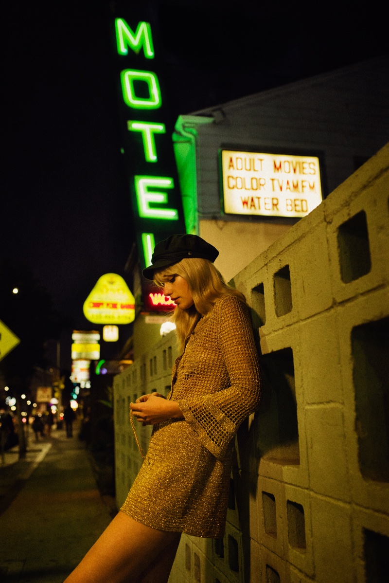 The model poses in a motel for the fashion editorial