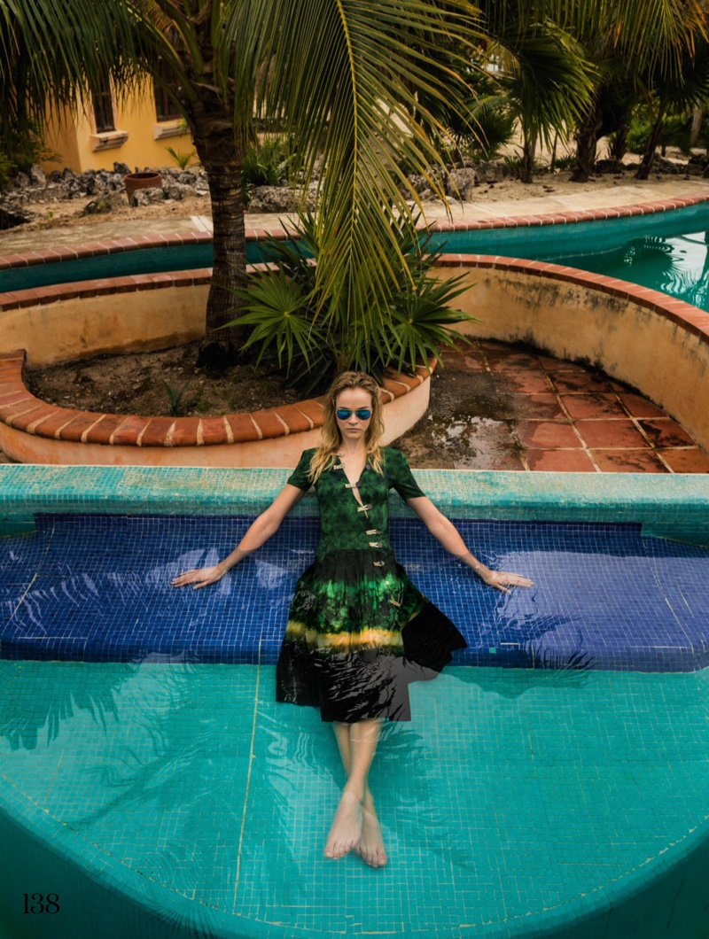 Going poolside, Ginta Lapina wears Altuzarra dress and Ray-Ban sunglasses