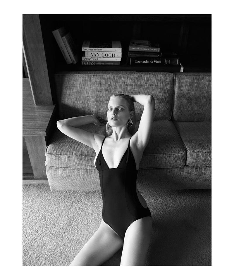 Photographed in black and white, Guinevere van Seenus wears a one-piece swimsuit